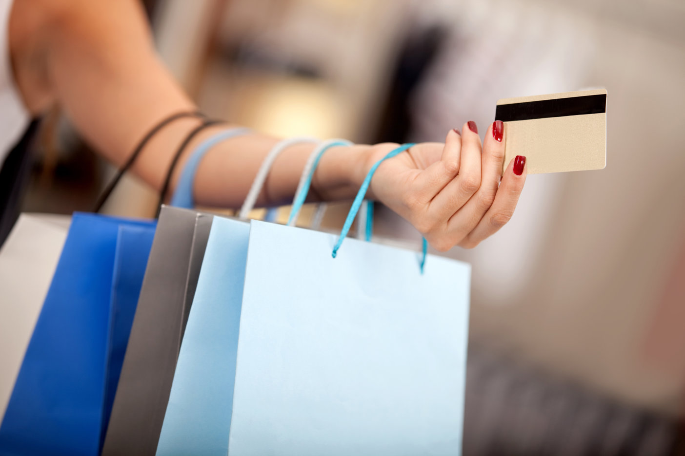 woman-with-shopping-bags-and-credit-card1-1